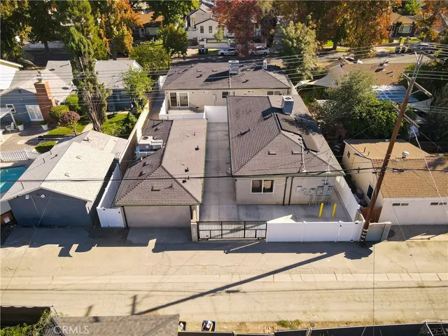 a view of kitchen with kitchen island a sink wooden floor and view living room