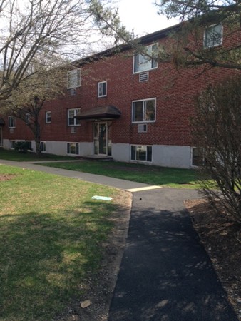 76 Bryon Road, Unit 5 Chestnut Hill, MA 02467 - Photo 10 of 10 a view of a brick house with a big yard