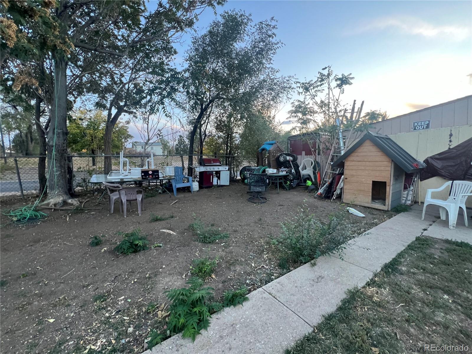 274 South Meade Street Denver, CO 80219 - Photo 13 of 14 a backyard of a house with table and chairs