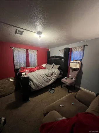 a bed room with a bed and furniture