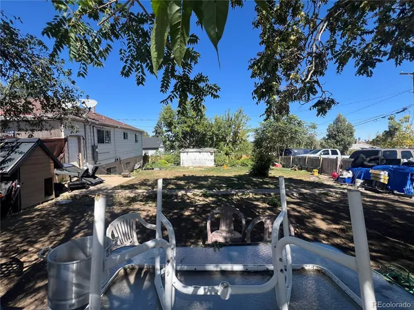 a view of a street with wooden benches