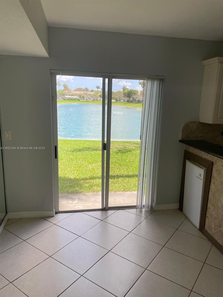 2701 Southeast 12th Road, Unit 106 Homestead, FL 33035 - Photo 11 of 21 a view of an empty room with a window
