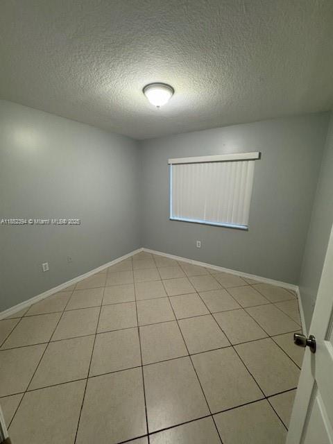 2701 Southeast 12th Road, Unit 106 Homestead, FL 33035 - Photo 15 of 21 a view of an empty room and window