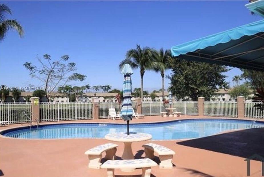 2701 Southeast 12th Road, Unit 106 Homestead, FL 33035 - Photo 5 of 21 a view of a swimming pool with a patio