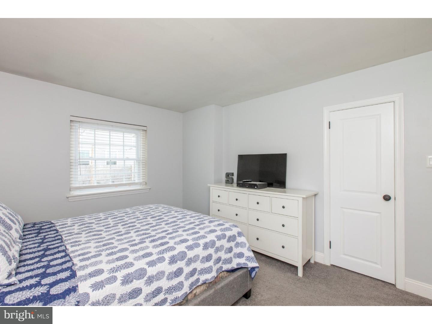 1238 Dill Road Havertown, PA 19083 - Photo 15 of 23 a bedroom with a bed and a flat tv screen on dresser