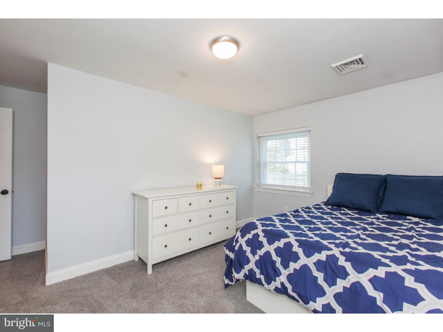 1238 Dill Road Havertown, PA 19083 - Photo 16 of 23 a bedroom with a large bed and a window