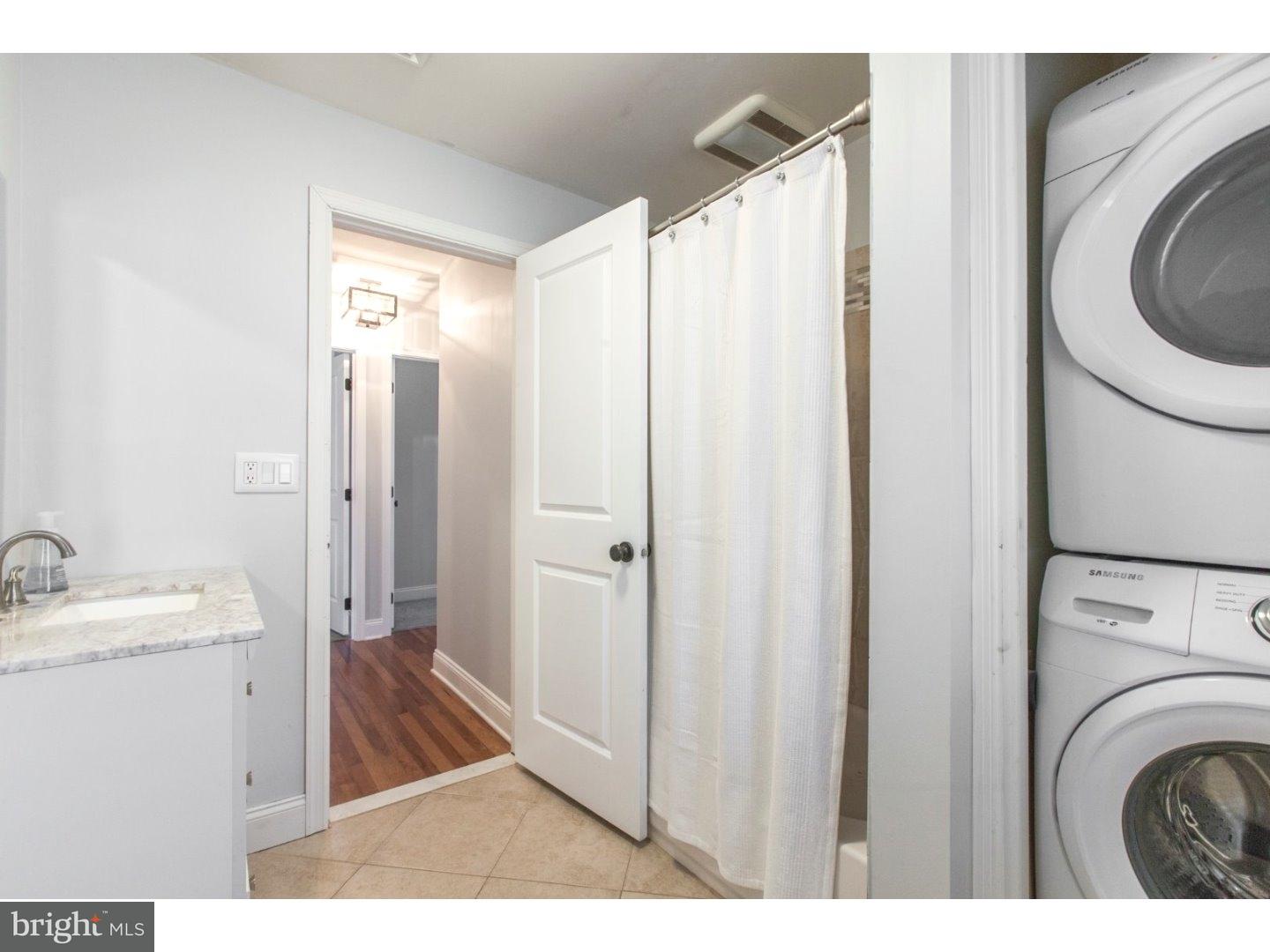 1238 Dill Road Havertown, PA 19083 - Photo 20 of 23 a view of a bathroom with washing machine and a sink