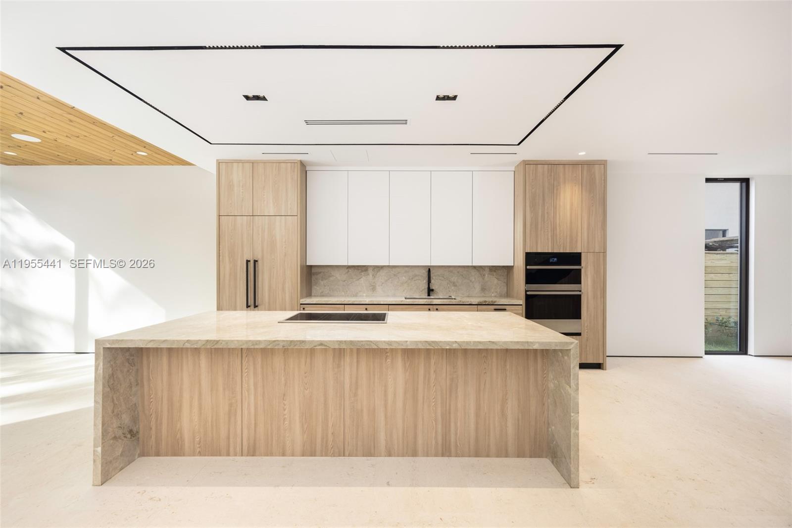 3144 Elizabeth Street Coconut Grove, FL 33133 - Photo 14 of 39 a kitchen with kitchen island a stove a refrigerator and a sink