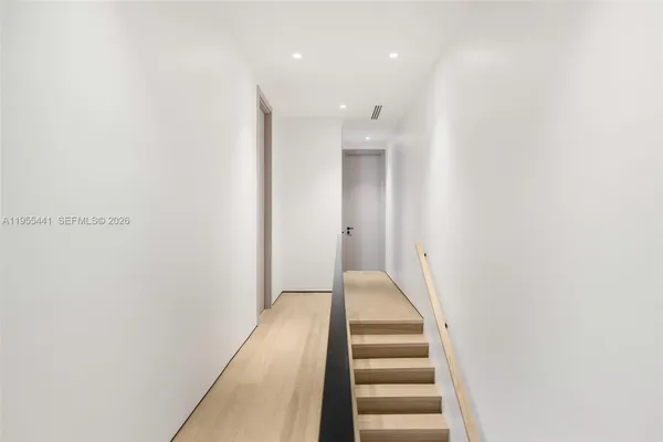 a bed room with a bed and a balcony