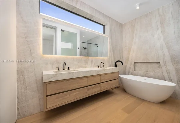 a bathroom with a bathtub and a sink