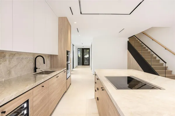 a view of a kitchen with microwave and cabinets