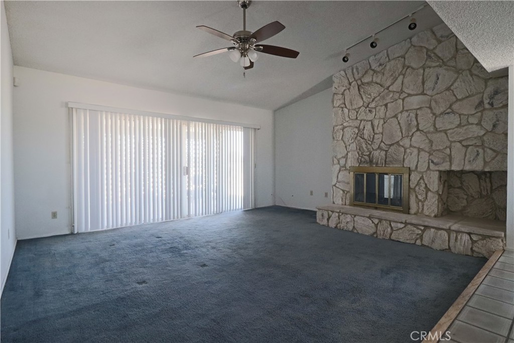 4752 Flying H Road Twentynine Palms, CA 92277 - Photo 16 of 55 a view of a livingroom with a fireplace