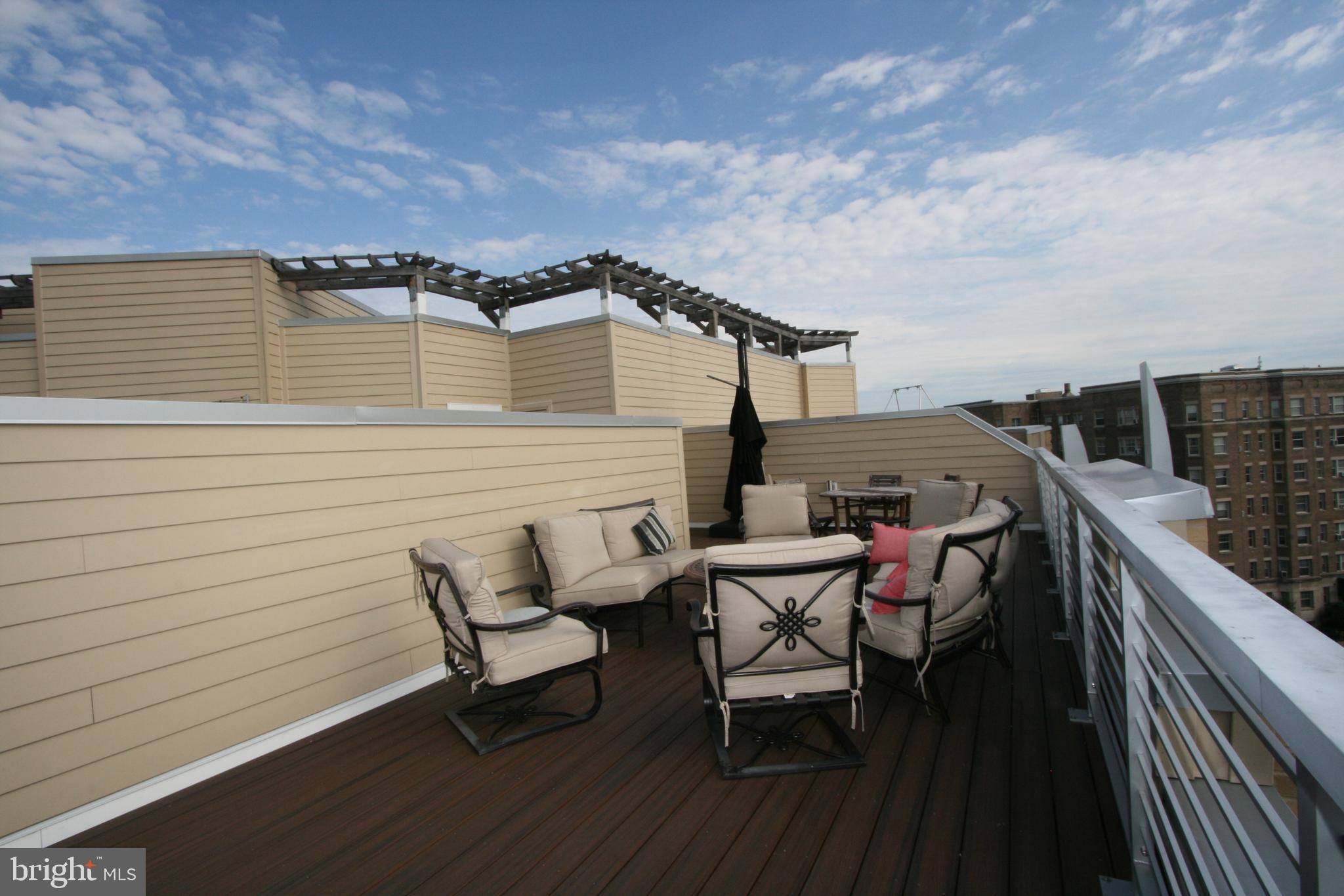 2550 17th Street Northwest, Unit 612 Washington, DC 20009 - Photo 32 of 55 a view of a terrace with chairs