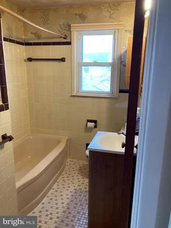 a bathroom with a sink and a bathtub