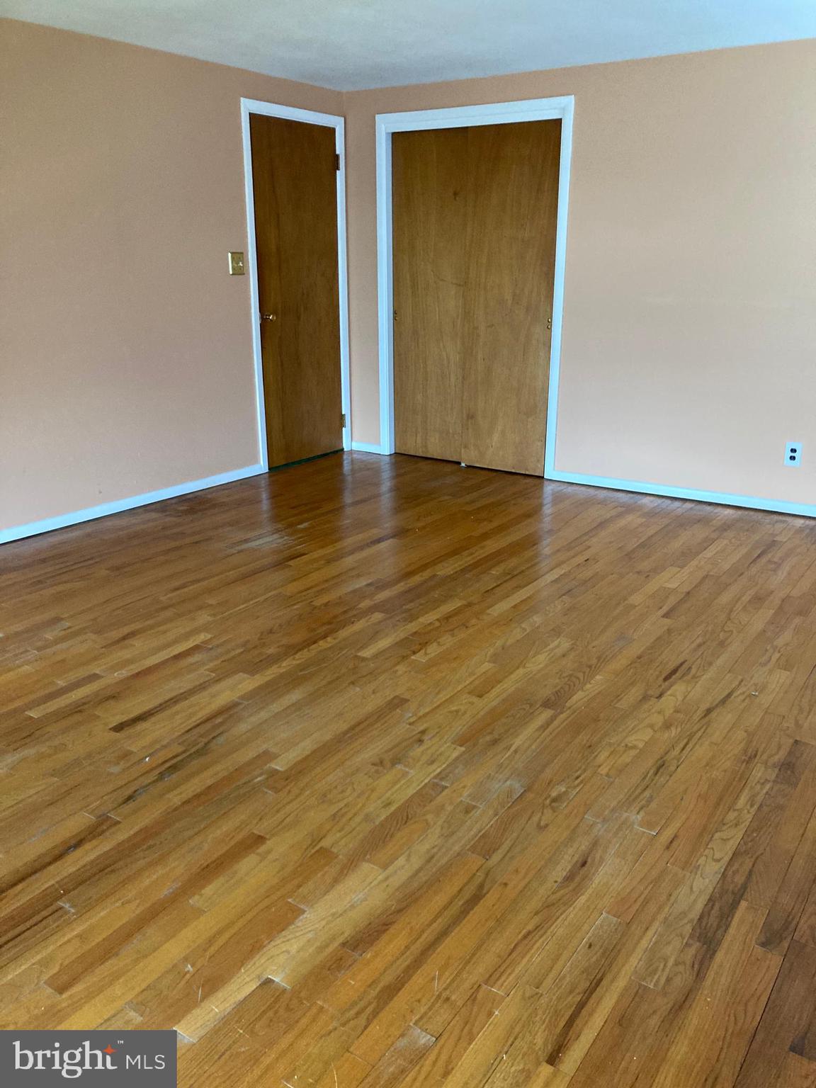 25 Mallory Way Hamilton, NJ 08610 - Photo 16 of 20 a view of an empty room with wooden floor and closet