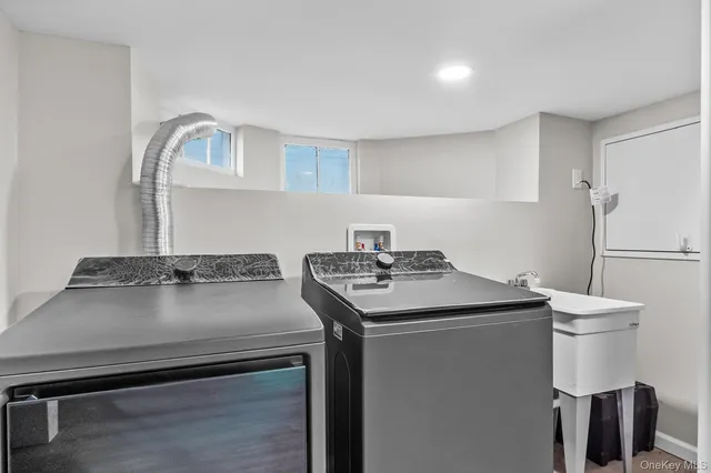 a utility room with dryer and washer