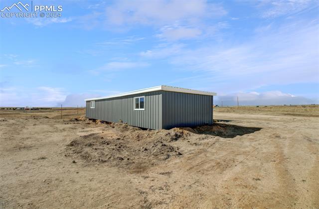 9765 Berridge Road Calhan, CO 80808 - Photo 12 of 27 View of outbuilding with a rural view