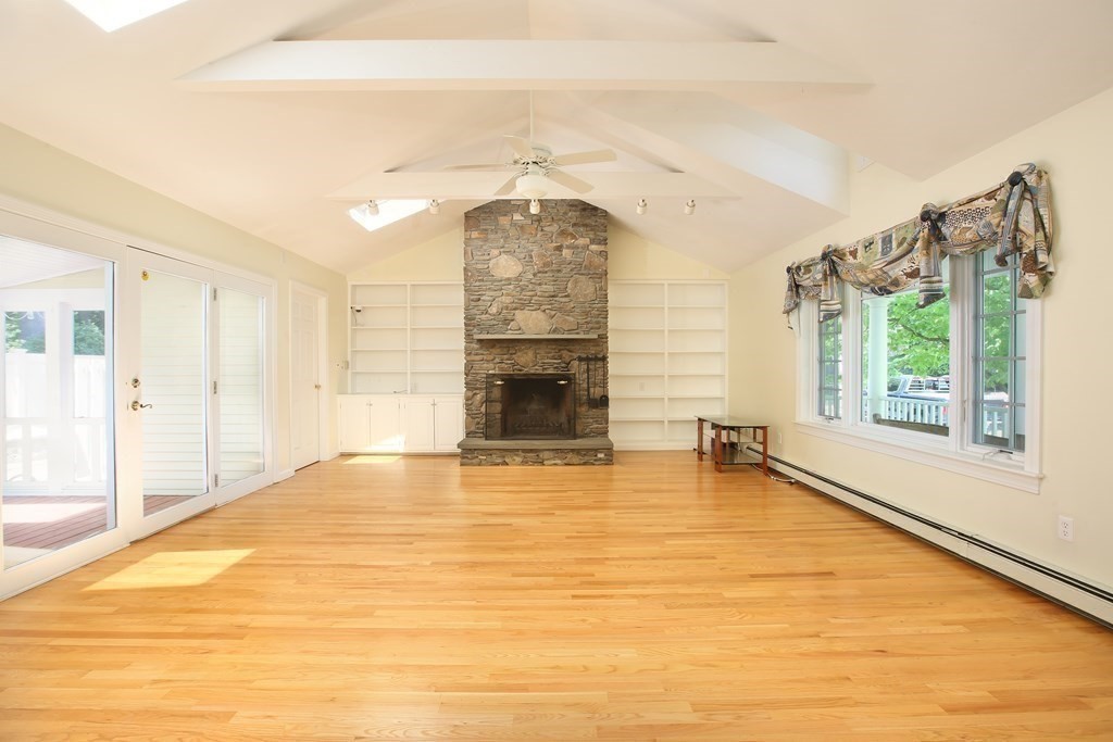 5 Charles Everett Way Hingham, MA 02043 - Photo 12 of 27 a view of an empty room with a fireplace and a window