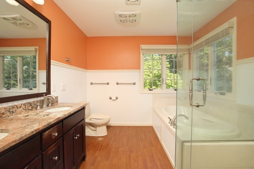 5 Charles Everett Way Hingham, MA 02043 - Photo 15 of 27 a bathroom with a granite countertop sink toilet and shower
