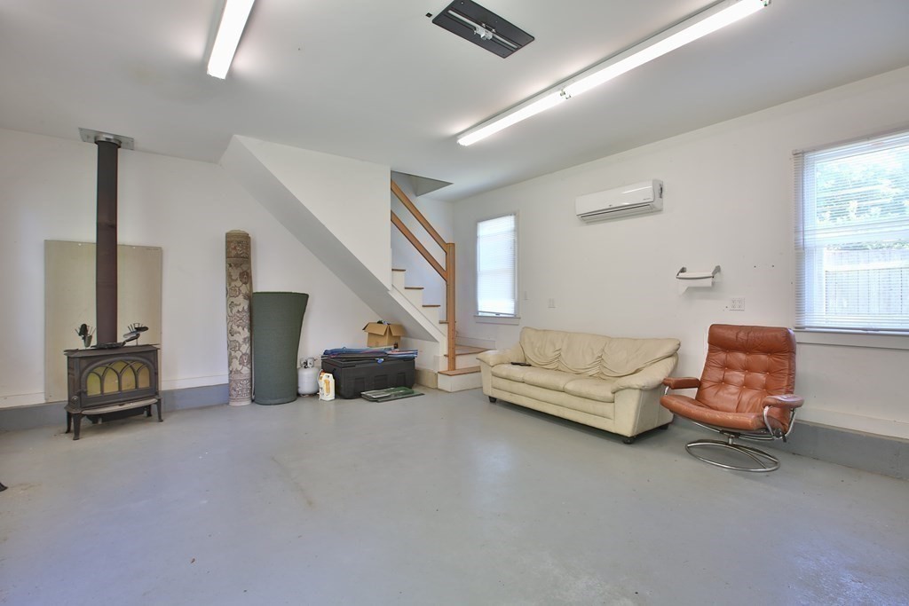 5 Charles Everett Way Hingham, MA 02043 - Photo 23 of 27 a living room with furniture and a flat screen tv