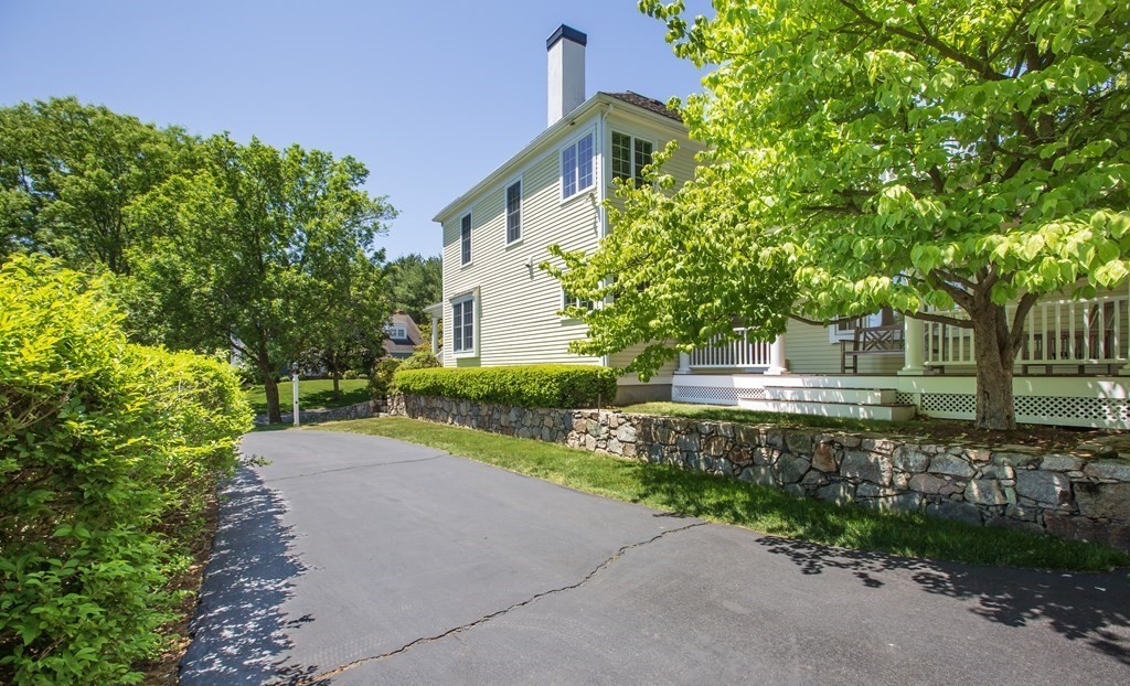 5 Charles Everett Way Hingham, MA 02043 - Photo 3 of 27 a front view of a house with a yard and a garden
