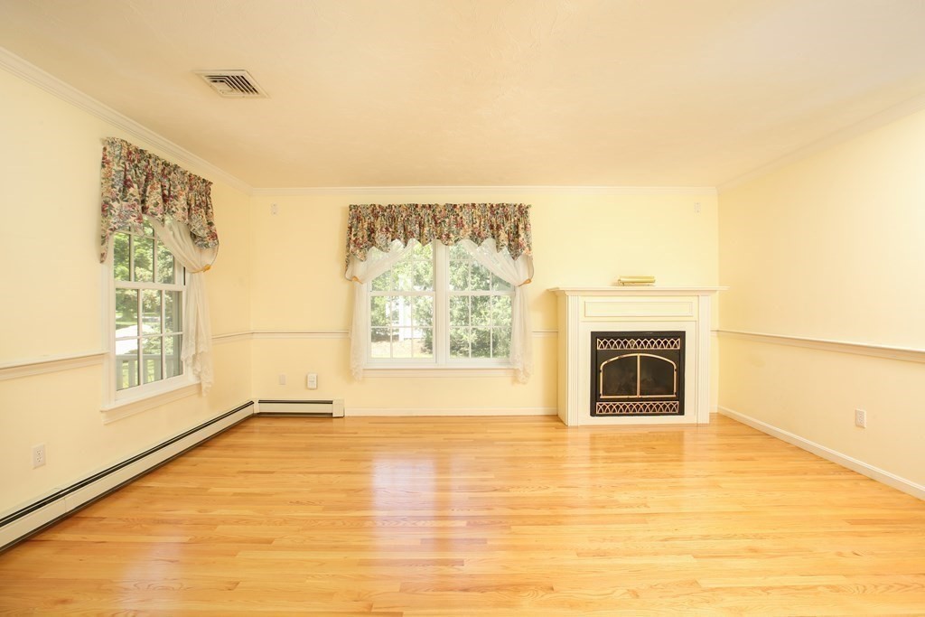 5 Charles Everett Way Hingham, MA 02043 - Photo 8 of 27 a view of a livingroom with a fireplace