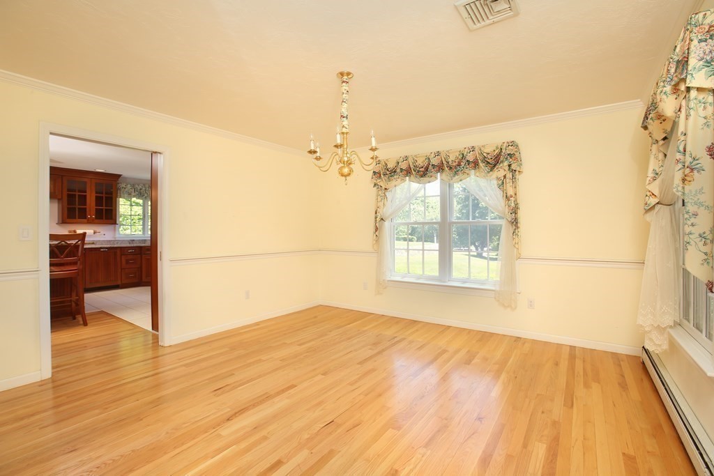 5 Charles Everett Way Hingham, MA 02043 - Photo 9 of 27 a view of empty room with wooden floor and fan