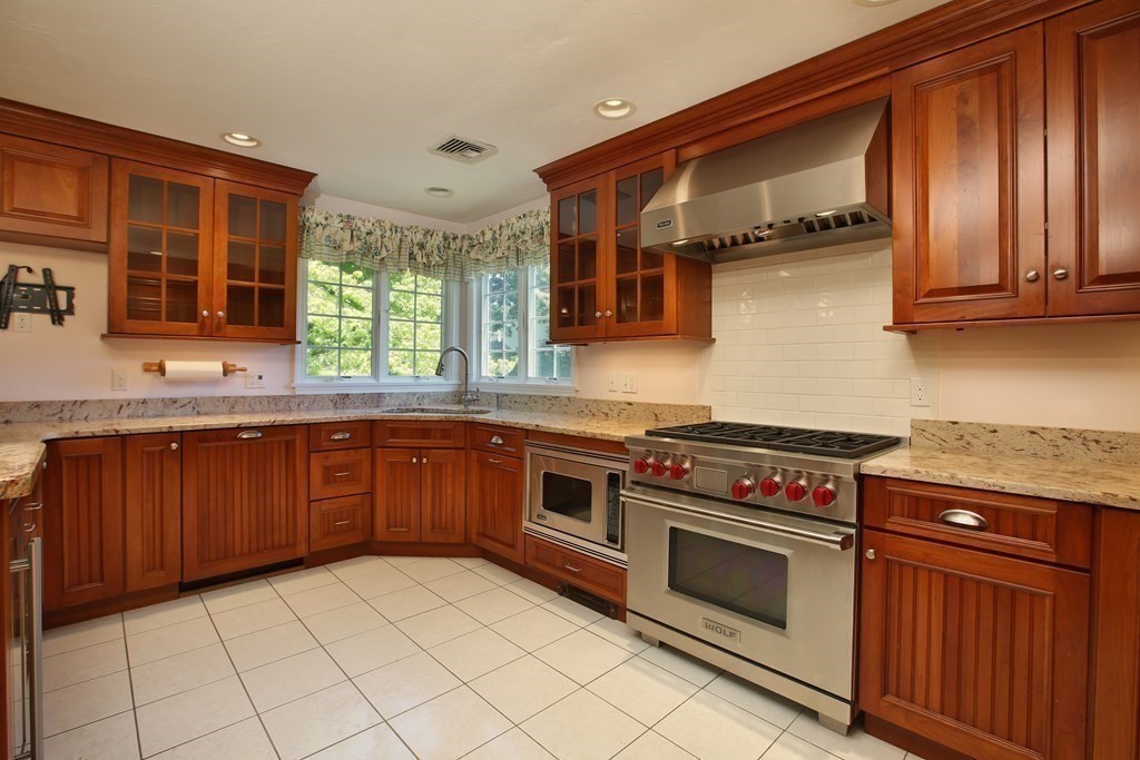 5 Charles Everett Way Hingham, MA 02043 - Photo 10 of 27 a kitchen with stainless steel appliances granite countertop a stove a sink and a microwave