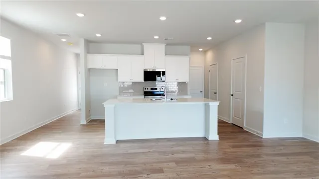 a view of kitchen with wooden floor