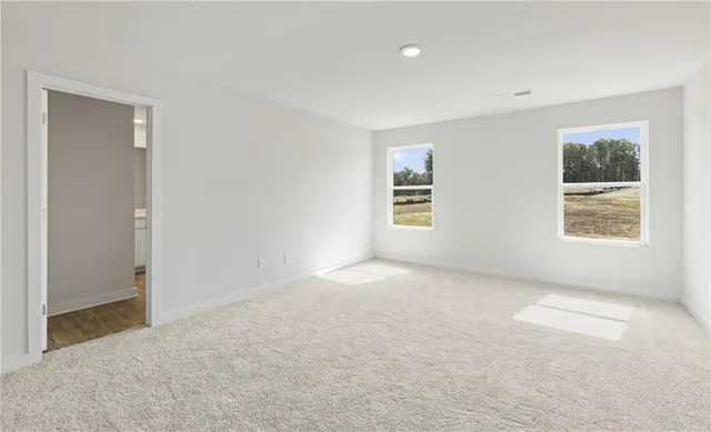 a view of an empty room with a window