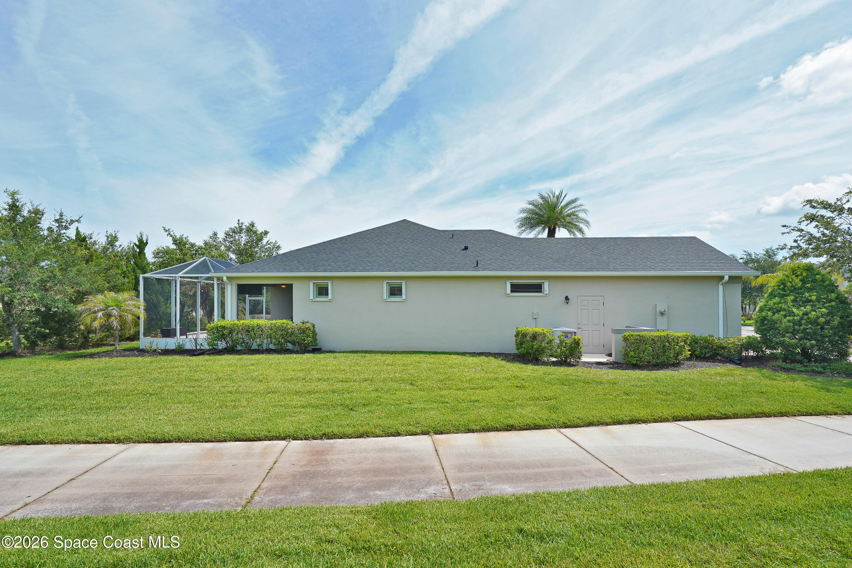 7170 Ralston Street Melbourne, FL 32940 - Photo 25 of 77 Side Yard Sidewalk
