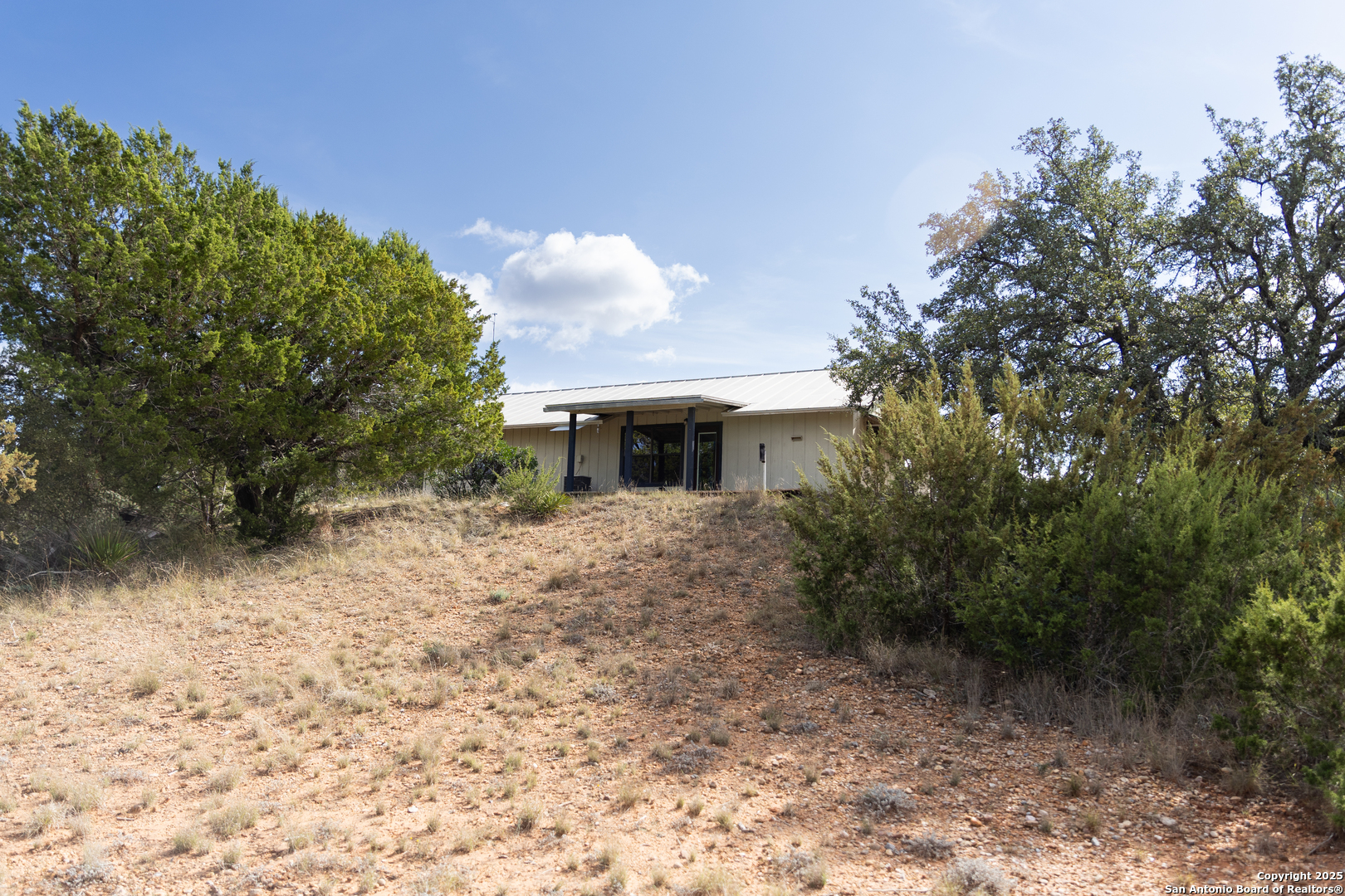 1318 Kc 3151 Junction, TX 76849 - Photo 15 of 25 a front view of a house with a yard and garage