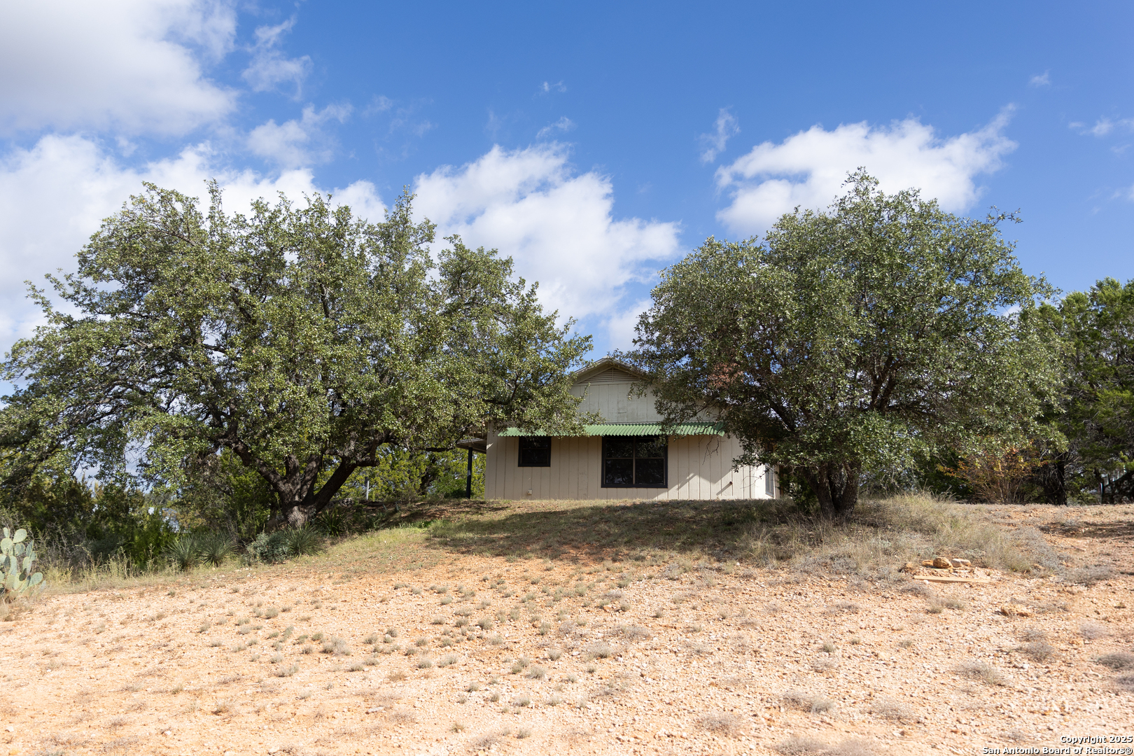 1318 Kc 3151 Junction, TX 76849 - Photo 16 of 25 a view of a yard with a tree