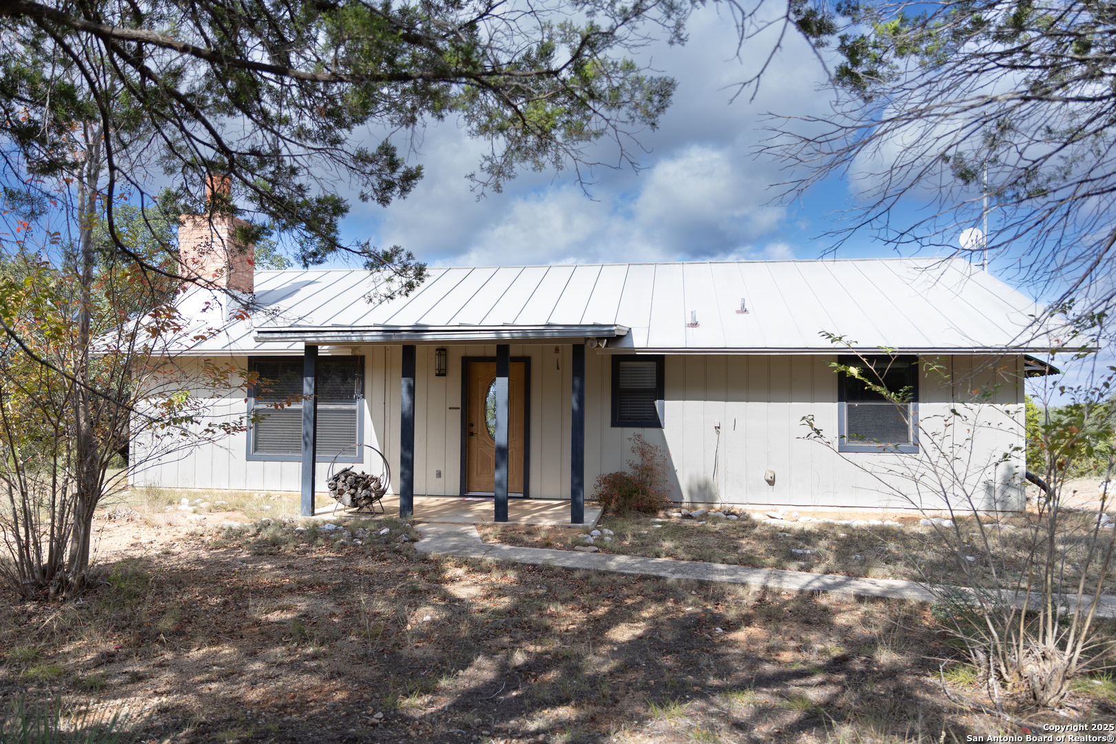 1318 Kc 3151 Junction, TX 76849 - Photo 2 of 25 a view of a house with a yard and garage