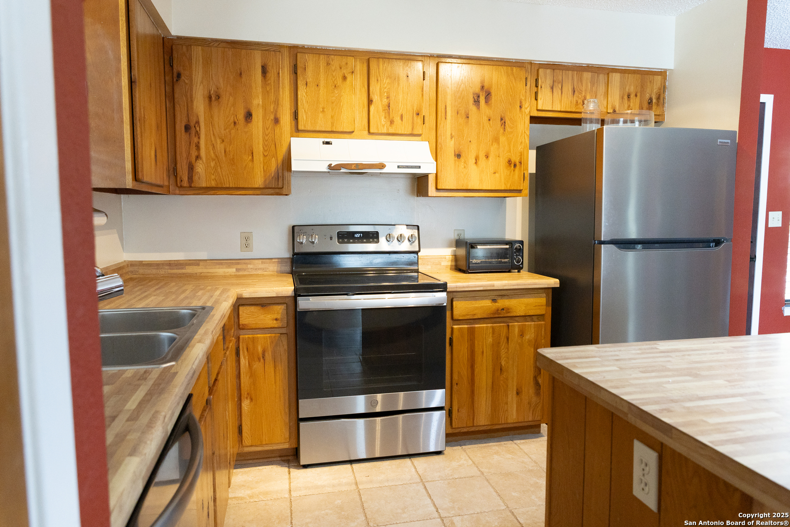 1318 Kc 3151 Junction, TX 76849 - Photo 9 of 25 a kitchen with a sink a stove and refrigerator