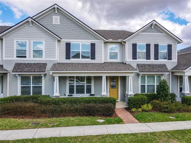 a front view of a house with a yard