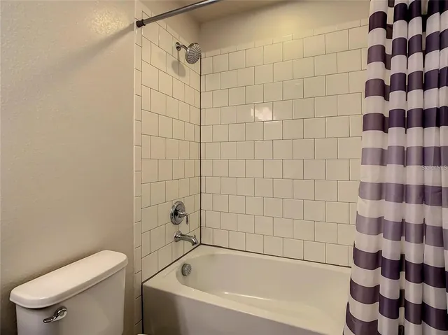 a view of a livingroom with furniture and storage