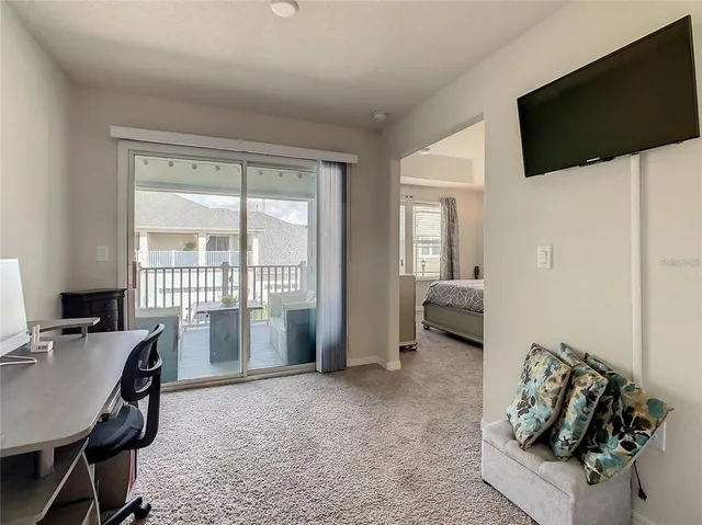 a view of a garage with a bike and a car