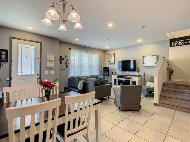 a living room with furniture and flat screen tv