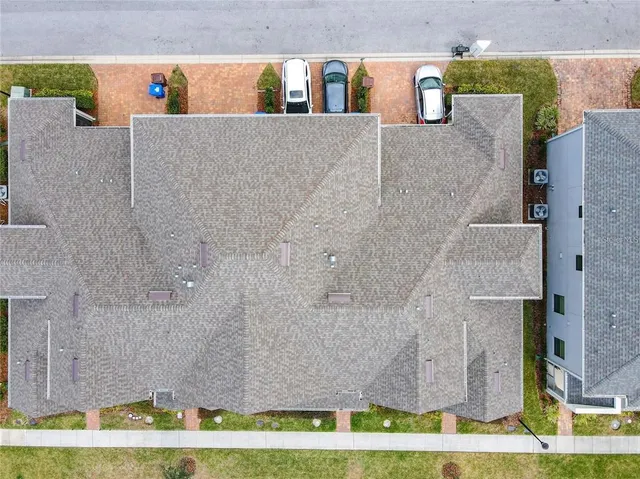 a view of a house with a swimming pool and a yard