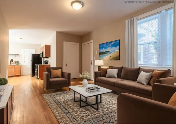 a living room with furniture and a rug