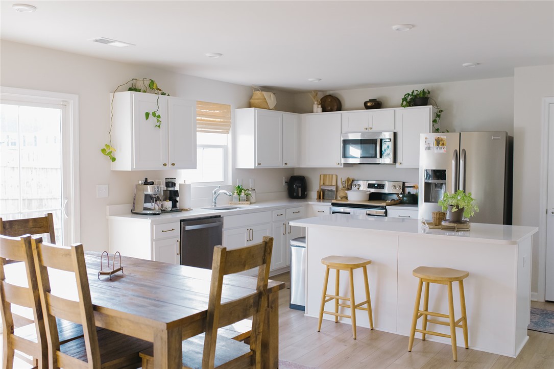 314 Callie Way Easley, SC 29642 - Photo 15 of 27 This bright kitchen features modern appliances and an inviting island, perfect for casual dining and entertaining.