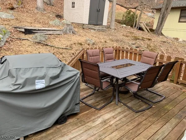 a view of a backyard with table and chairs