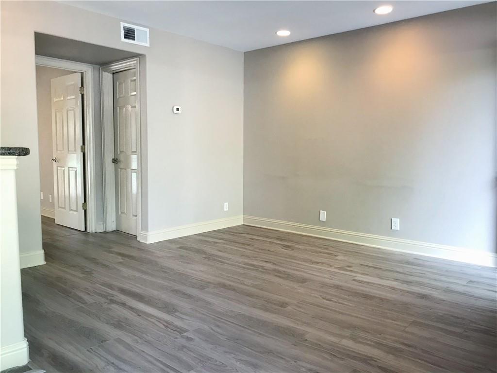 500 East Riverside Drive, Unit 154 Austin, TX 78704 - Photo 7 of 13 Unfurnished room featuring dark wood-style flooring and recessed lighting