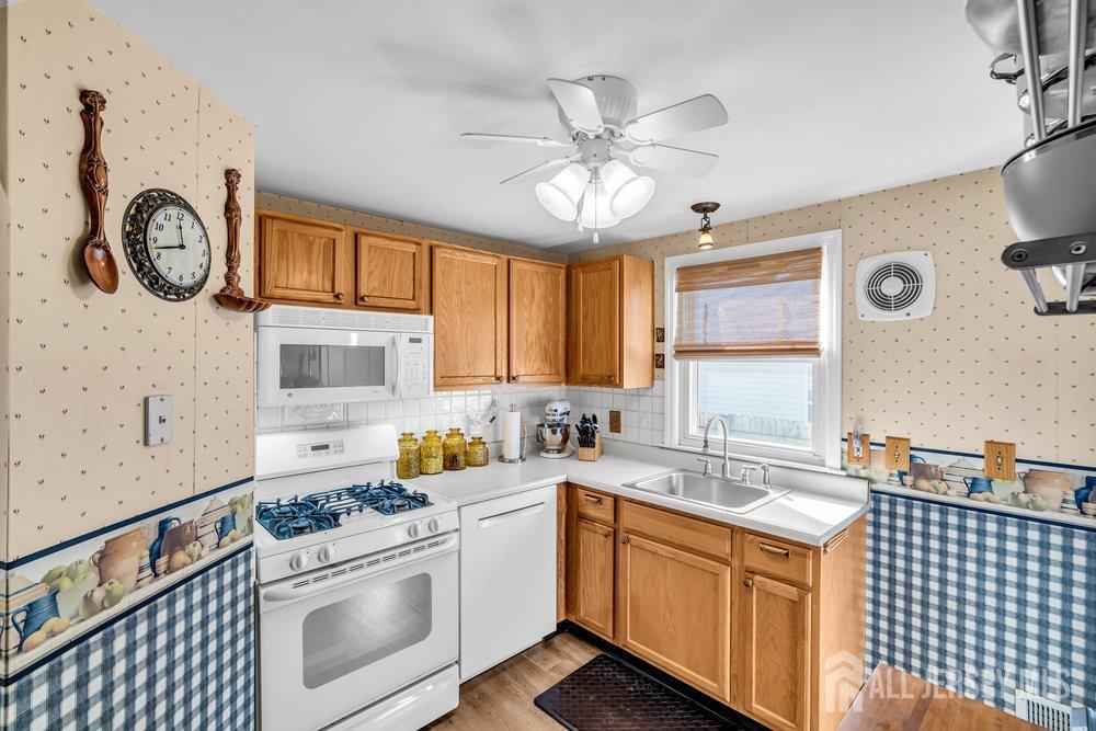 720 Voorhees Avenue Middlesex, NJ 08846 - Photo 13 of 28 a kitchen with stainless steel appliances granite countertop a sink and cabinets