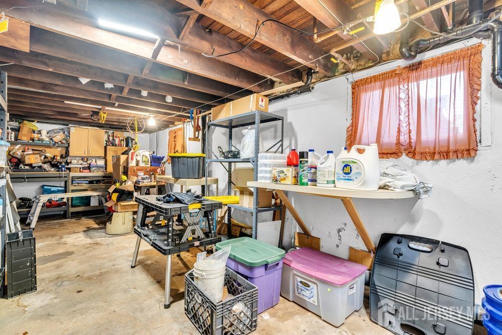 720 Voorhees Avenue Middlesex, NJ 08846 - Photo 21 of 28 a room with lots of furniture and a chandelier