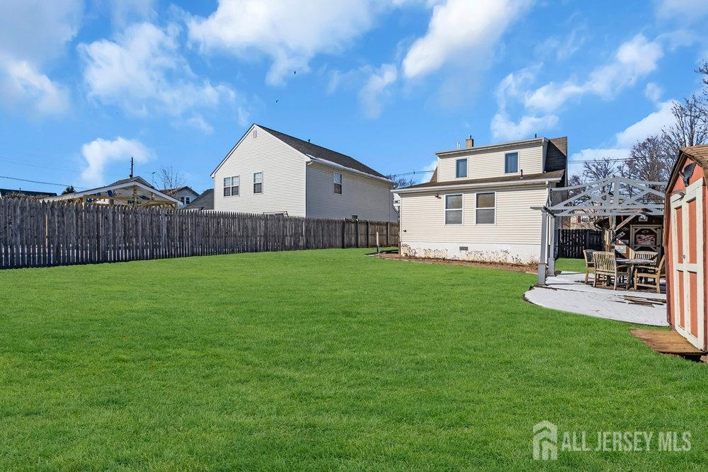 720 Voorhees Avenue Middlesex, NJ 08846 - Photo 23 of 28 a view of a house with a yard and sitting area