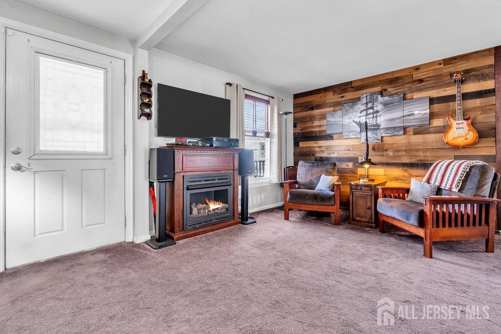 720 Voorhees Avenue Middlesex, NJ 08846 - Photo 4 of 28 a living room with furniture and a flat screen tv