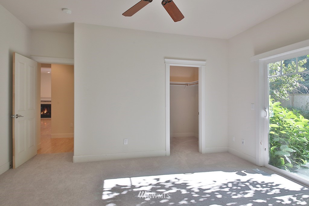 1822 East Watkins Road Freeland, WA 98249 - Photo 11 of 25 a view of an empty room with wooden floor and a window