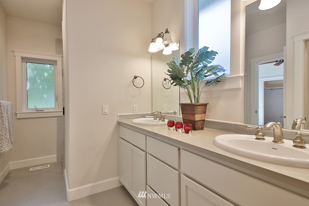 1822 East Watkins Road Freeland, WA 98249 - Photo 13 of 25 a bathroom with a sink a vanity and a mirror